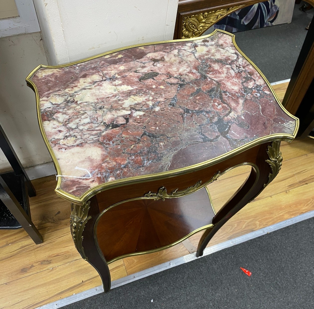 A mid 20th century French gilt metal mounted mahogany marble topped two tier table, width 50cm, depth 35cm, height 95cm
